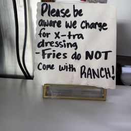 The sign dressing doesn't come with the fries.