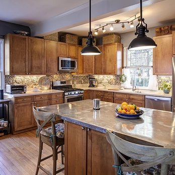 Rhome Profile Construction - a kitchen with a center island - Flooring Near Me - Huntington Beach, California Rhome Profile Construction - a kitchen with a center island - Flooring Near Me - Huntington Beach, California