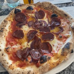 Pepperoni and red onion pizza