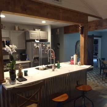 Inside Out Construction - Metal front bar. And love the wrapped wood beams and shiplap ceilings. - General Contractors Near Me
