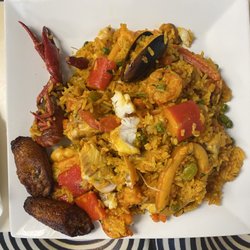 Delicias Colombianas - Plato marinero/ seafood plate A great mix of seafood, rice, sweet plantains.