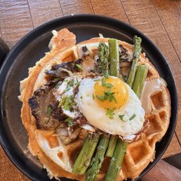 The Dope One - a mushroom centric and asparagus heavy meal on a waffle topped with an egg perfectly done. The Dope One - a mushroom centric and asparagus heavy meal on a waffle topped with an egg perfectly done.