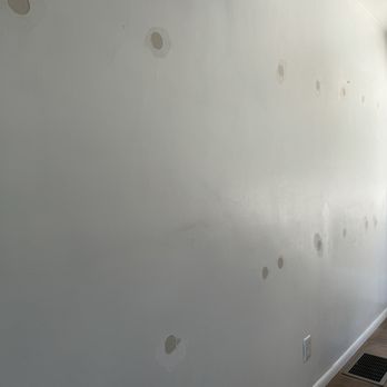 Marathon Insulation - Skim patch of living room wall after blown in insulation by Marathon Insulation. - Insulation Installation Near Me