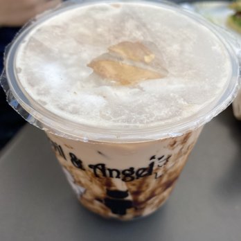 Devil & Angel Desserts - dalgona candy (?) inside the black sugar royal milk tea floating on the top center (eventually started dissolving) - Bubble Tea Near Me - Concord, California