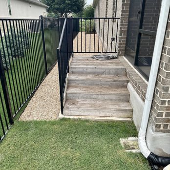 Constant Lawn and Gardener - Before picture: not enough stairs, top landing too small, gutter downspout in the wrong location to accommodate newly design stairs - Tree Services Near Me