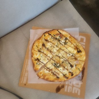 Cidercade Austin - PEAR + PROSCIUTTO $13 olive oil, prosciutto, mozzarella, parmesan, goat cheese, basil, pear, with crackberry balsamic reduction - Pizza Near Me - Austin, Texas