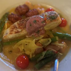 Tabernash Tavern - Pan-Seared Alaskan Halibut in saffron citrus broth, accompanied by asparagus, fennel, white beans, and heirloom tomatoes.
