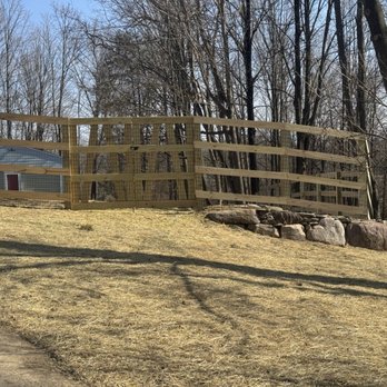 Sublime Landscaping - Country style fence surrounding the customers property line with a large boulder retaining wall - Landscaping Near Me - Warwick, New York Sublime Landscaping - Country style fence surrounding the customers property line with a large boulder retaining wall - Landscaping Near Me - Warwick, New York