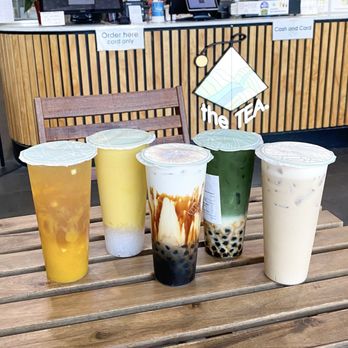 The Tea - left to right: mango fruit tea, mango pomelo sago, toasted brown sugar milk boba, matcha latte with boba, and no18 golden mellow milk tea - Coffee & Tea Near Me - Monterey Park, California The Tea - left to right: mango fruit tea, mango pomelo sago, toasted brown sugar milk boba, matcha latte with boba, and no18 golden mellow milk tea - Coffee & Tea Near Me - Monterey Park, California