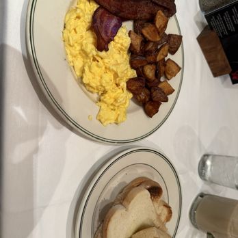 Manny's Steakhouse - Scrambled eggs, bacon, breakfast potatoes, and sourdough toast. - Steakhouses Near Me - Minneapolis, Minnesota Manny's Steakhouse - Scrambled eggs, bacon, breakfast potatoes, and sourdough toast. - Steakhouses Near Me - Minneapolis, Minnesota
