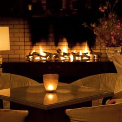 The Lounge - Enjoy the warm and luxurious atmosphere in front of the fireplace at the Lobby Lounge.
