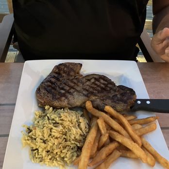 Backwaters on Sand Key - Angus ribeye with rice and fries - Seafood Near Me - Clearwater Beach, Florida Backwaters on Sand Key - Angus ribeye with rice and fries - Seafood Near Me - Clearwater Beach, Florida