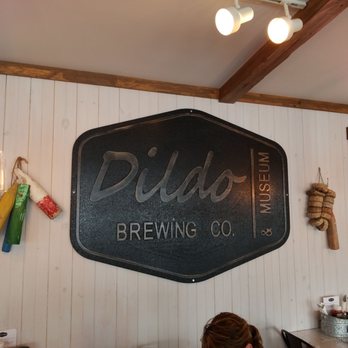 Dildo Brewing - a woman sitting at a table - Brewpubs Near Me - Dildo, Newfoundland and Labrador