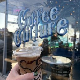 Peanut butter guts mocha and window outside Peanut butter guts mocha and window outside