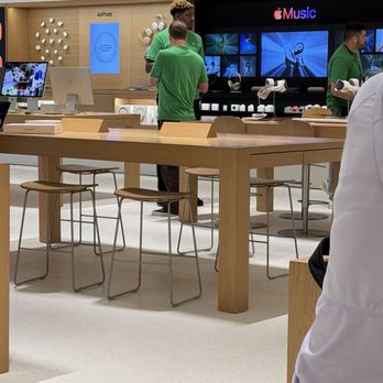 Apple Del Amo - Green shirt employees chatting in the store. - Electronics Near Me - Torrance, California