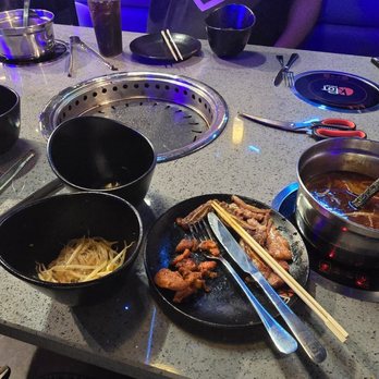 KPOT Korean BBQ & Hot Pot - The look of our table halfway through the meal - Barbeque Near Me - Methuen, Massachusetts KPOT Korean BBQ & Hot Pot - The look of our table halfway through the meal - Barbeque Near Me - Methuen, Massachusetts