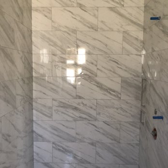 Ceramic Solutions - a bathroom with a marble shower - Flooring Near Me Ceramic Solutions - a bathroom with a marble shower - Flooring Near Me