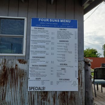 Four Suns Fish And Chips - a menu on the side of a building - Seafood Near Me - Hancock, Michigan
