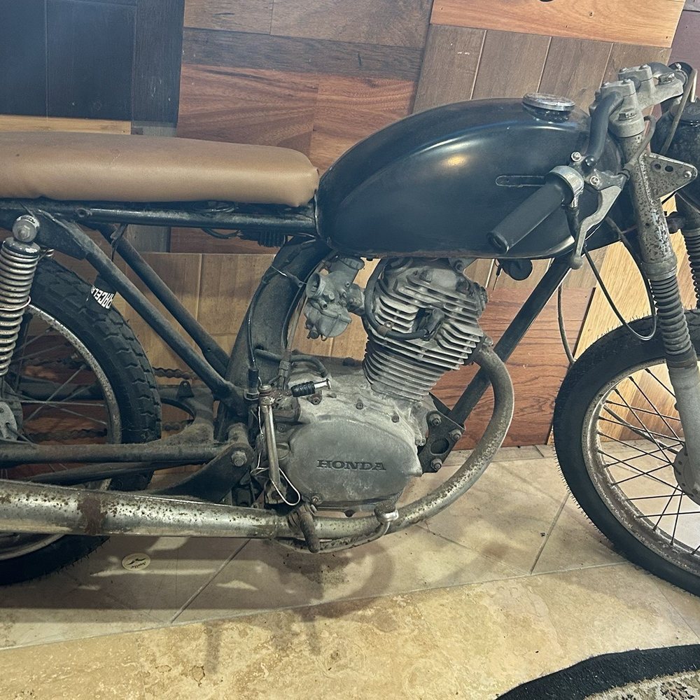 The Surfinista - Neat interior, take this old cafe racer for example. - Juice Bars & Smoothies Near Me - Cocoa Beach, Florida