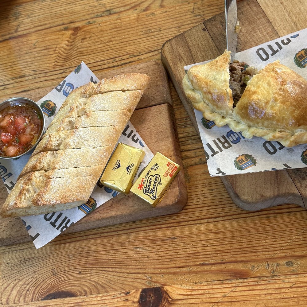 Fiorito - house bread with fresh salsa, and steak empanada - Argentine Near Me - Miami, Florida Fiorito - house bread with fresh salsa, and steak empanada - Argentine Near Me - Miami, Florida