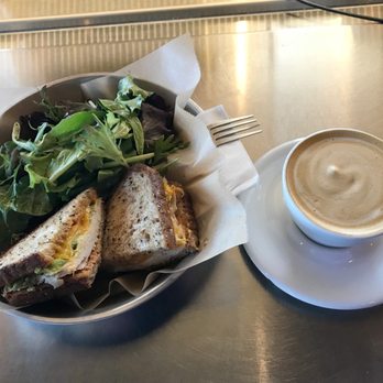 Jubala Coffee - Turkey and avocado sandwich with a side arugula/balsamic salad and a cappuccino - Coffee & Tea Near Me - Raleigh, North Carolina Jubala Coffee - Turkey and avocado sandwich with a side arugula/balsamic salad and a cappuccino - Coffee & Tea Near Me - Raleigh, North Carolina