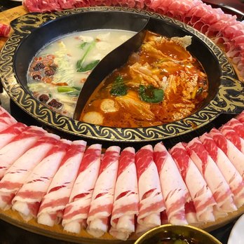 Chengdu Memory - Pork bone broth (left), tomato base (right) with beef, lamb, pork meat! - Hot Pot Near Me - Seattle, Washington