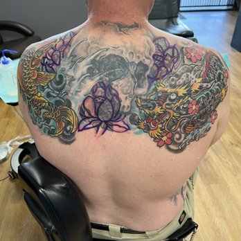 Tattoo Cathedral - 3rd session- let's add some lotus to cover up those roses and fix that skull - Tattoo Near Me - Fort Worth, Texas