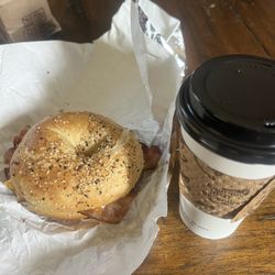 Bacon, egg, cheese breakfast sandwich on an everything bagel and a vanilla latte