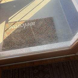 Glass front door, dirty. I realize "glass doors" isn't specified in their list, but seems like a standard item.