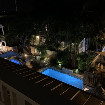 Alexander's Guesthouse - Overlooking pool from second floor sitting area/deck - Guest Houses Near Me - Key West, Florida