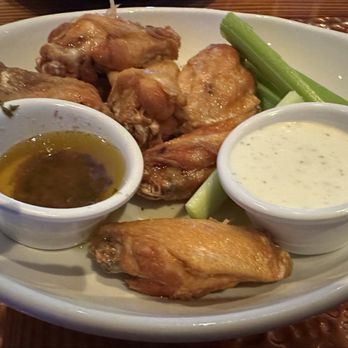 Miller's Ale House - Traditional wings with garlic butter on side with celery and ranch dressing - Sports Bars Near Me - Palm Coast, Florida Miller's Ale House - Traditional wings with garlic butter on side with celery and ranch dressing - Sports Bars Near Me - Palm Coast, Florida
