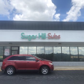 Sugar Hill Subs - Exterior with a car (not my car) - Sandwiches Near Me - Sugar Hill, Georgia Sugar Hill Subs - Exterior with a car (not my car) - Sandwiches Near Me - Sugar Hill, Georgia