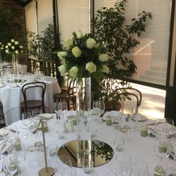 Pretty Petals - Beautiful tall glass vase wedding table arrangement with ivory roses.