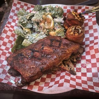 The Palomino - Ribs, brisket, and chicken with bacon wrapped corn and a Caesar salad - Barbeque Near Me - Calgary, Alberta