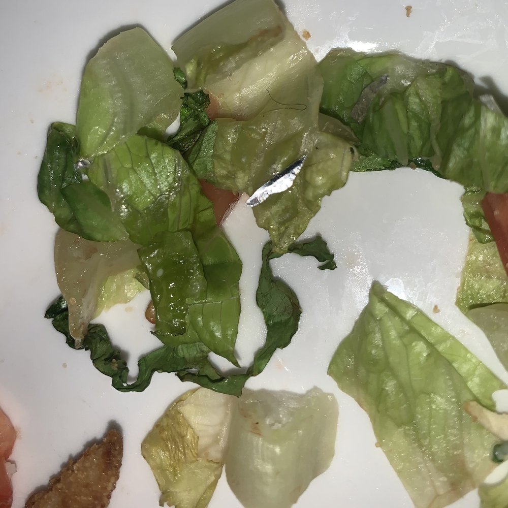 Seafood Kitchen - pieces of tinfoil and hair in lettuce from fish tacos - Seafood Near Me - Atlantic Beach, Florida