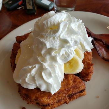 Patty's Eggnest - Here it is! Elvis peanut butter and banana French toast topped with devonshire cream. Heaven! - Breakfast & Brunch Near Me - Mukilteo, Washington Patty's Eggnest - Here it is! Elvis peanut butter and banana French toast topped with devonshire cream. Heaven! - Breakfast & Brunch Near Me - Mukilteo, Washington