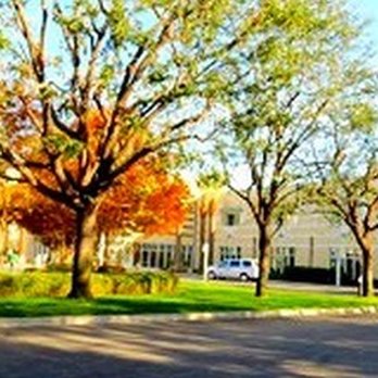 Venable's Tree Service - a parking lot in front of a building - Tree Services Near Me - Bakersfield, California