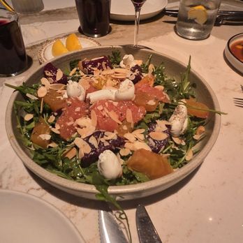 The Amalfi Llama - Roasted Beet Salad, and the pinot noir glass of wine. arugula, goat cheese, roasted red and yellow beets, grapefruit, and sliced almonds. - Italian Near Me - San Diego, California