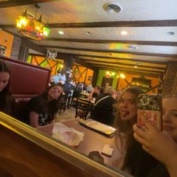 Fiesta Grande Authentic Mexican Grill - Us waiting for food eating chips and salsa and ordering off the menu in the booth