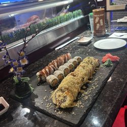Hayashi Japanese Steakhouse - Back roll- California Fortune Roll Middle Roll- San Francisco Roll Front Roll- OMG Roll