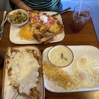 Old West Cafe - Bull-rider and the queso covered chicken fried chicken (very good to my amazement), fried okra and hash brown casserole. - Breakfast & Brunch Near Me - Grapevine, Texas Old West Cafe - Bull-rider and the queso covered chicken fried chicken (very good to my amazement), fried okra and hash brown casserole. - Breakfast & Brunch Near Me - Grapevine, Texas