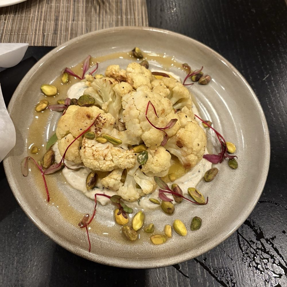 Gallery Restaurant - Roasted Cauliflower Appetizer over tahini tzatziki w/ pistachios - New American Near Me - Charlotte, North Carolina Gallery Restaurant - Roasted Cauliflower Appetizer over tahini tzatziki w/ pistachios - New American Near Me - Charlotte, North Carolina