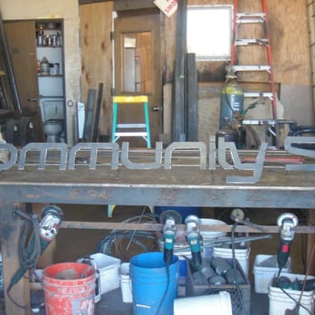 Community Skis - Toddi building out the Community Skis sign. - Sporting Goods Near Me - Mammoth Lakes, California Community Skis - Toddi building out the Community Skis sign. - Sporting Goods Near Me - Mammoth Lakes, California