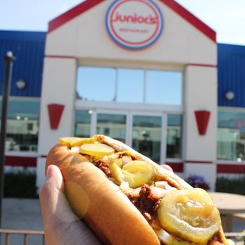 Junior's Restaurant - a hand holding a hot dog - Burgers Near Me - Winnipeg, Manitoba