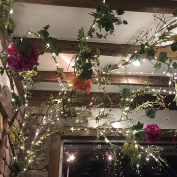Llama Restaurant - We had corner table with beautiful flowers and lights. - Peruvian Near Me - Saint Augustine, Florida