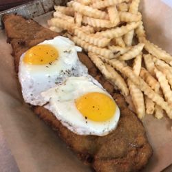 Grumpy Gaucho - Breaded Steak Sandwich with Fries / Milanesa a Caballo con Papas Fritas