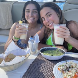 Eating fresh ceviche prepared right there and yummy guacamole. Don't forget those virgin pina colada's!