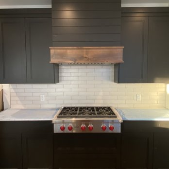 Mcdonald Construction - Wolfe cooktop with custom vented hood. - General Contractors Near Me - Burnsville, Minnesota