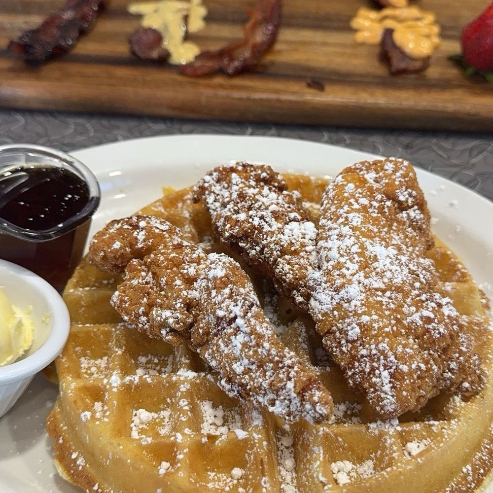 Biscuits Cafe - Chicken and waffle, bacon flight pictured in the back - Breakfast & Brunch Near Me - Peoria, Arizona Biscuits Cafe - Chicken and waffle, bacon flight pictured in the back - Breakfast & Brunch Near Me - Peoria, Arizona