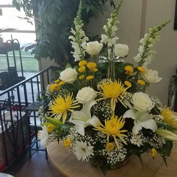 Jindra Floral - This is the white serenity, w/ yellow flowers added to it (at our request). It was beautiful and could be seen from the back of the church. - Florists Near Me - Cleveland, Ohio Jindra Floral - This is the white serenity, w/ yellow flowers added to it (at our request). It was beautiful and could be seen from the back of the church. - Florists Near Me - Cleveland, Ohio